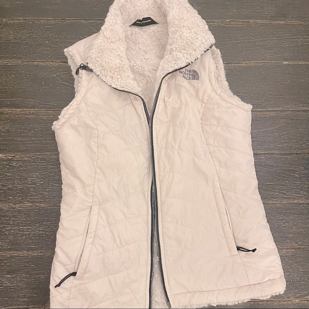 The North Face white fur zip-up vest